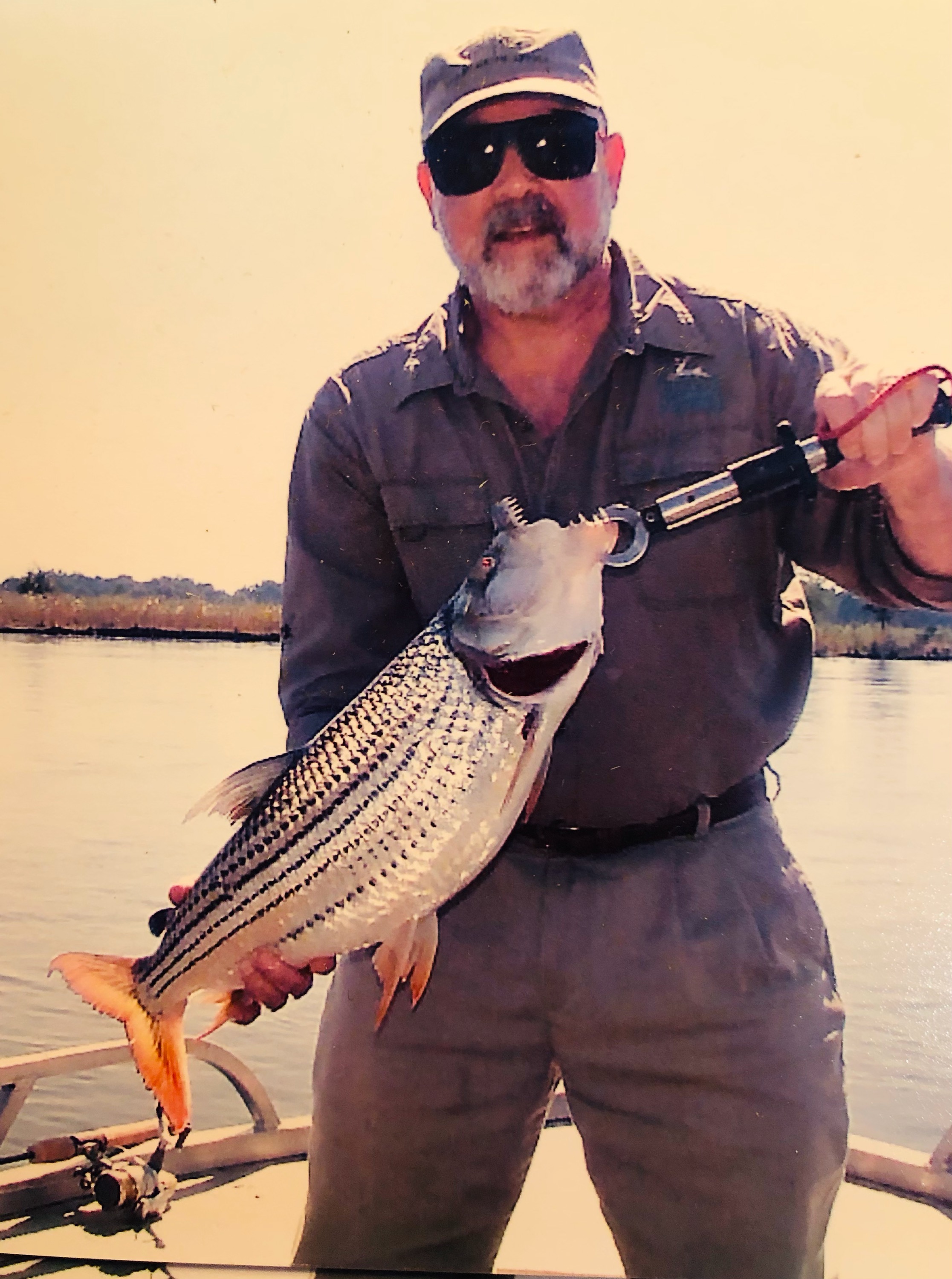 David Kotok with tiger fish caught in Zambezi River in Africa